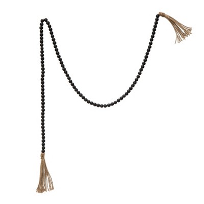 Storied Home Paulownia Wood Bead Garland with Jute Tassels, Distressed Black