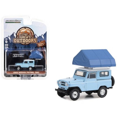 1969 Nissan Patrol (60) Light Blue with White Top and Camp'otel Cartop Sleeper Tent 1/64 Diecast Model Car by Greenlight