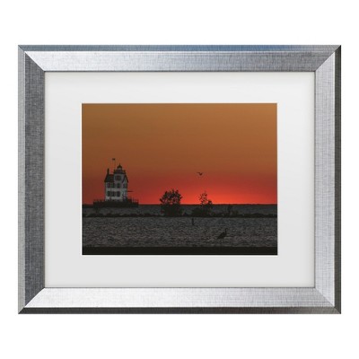 Trademark Fine Art - Kurt Shaffer Lake Erie's Lorain lighthouse at sunset Matted Framed Art