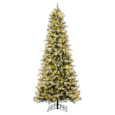 Vickerman 12' x 64" Frosted Glacier Pine Artificial Pre-Lit Christmas Tree with Folding Metal Tree Stand In a 40"Lx40"Wx6"H base.