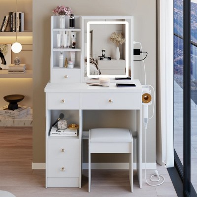 Vanity table with LED-lit mirror with power outlet and hairdryer shelving